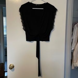 Zara black top with lace and tie. Lightly worn.